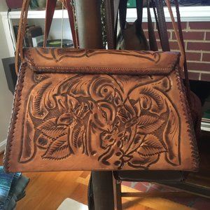 Stamped leather handbag with blanket stitch